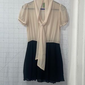 Tan and black dress. Sheer top with tie and lined black skirt bottom.